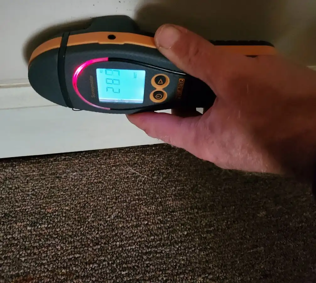 Moisture detection at baseboard during Storm Damage Restoration in Harrisburg